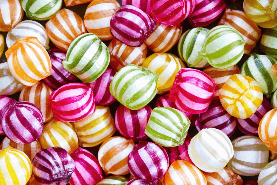 A close-up of brightly coloured striped boiled sweets